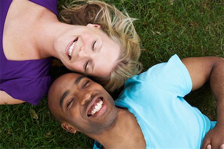 Couple Lying in Grass Stock Photo - Premium Royalty-Free, Code: 600-01540652