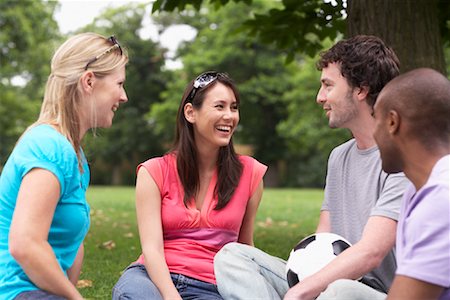 Friends Sitting Outdoors Stock Photo - Premium Royalty-Free, Code: 600-01540663