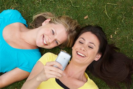 simsearch:700-01199784,k - Friends Looking at Cellular Phone Outdoors Stock Photo - Premium Royalty-Free, Code: 600-01540677