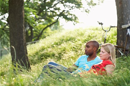 Couple Lying in Grass Stock Photo - Premium Royalty-Free, Code: 600-01540728