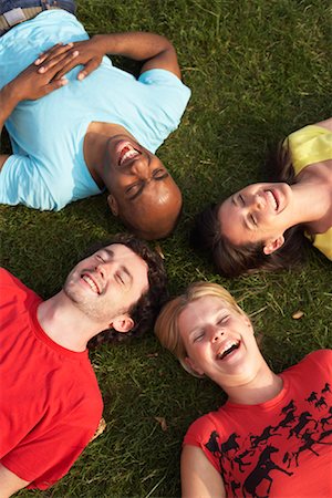 simsearch:700-01185080,k - Friends Lying in Grass Stock Photo - Premium Royalty-Free, Code: 600-01540723