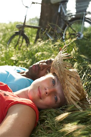 Couple Lying in Grass Stock Photo - Premium Royalty-Free, Code: 600-01540732