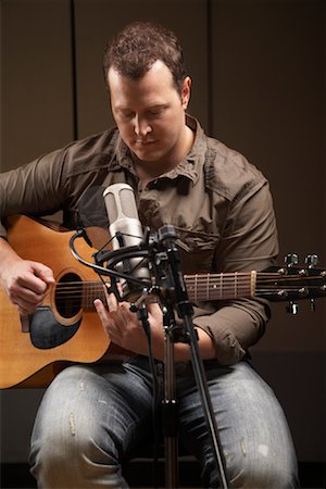 Man Playing Guitar in Recording Studio Stock Photo - Premium Royalty-Free, Code: 600-01540819