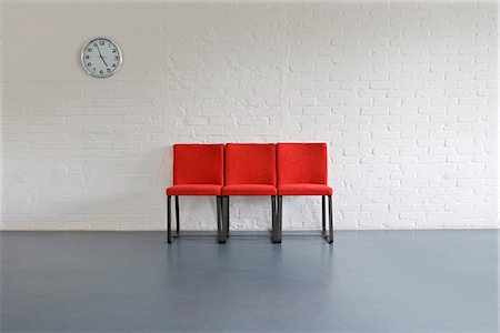 end of day - Red Chairs and Wall Clock Stock Photo - Premium Royalty-Free, Code: 600-01575602