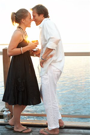 Couple by the Lake at Sunset Stock Photo - Premium Royalty-Free, Code: 600-01585720