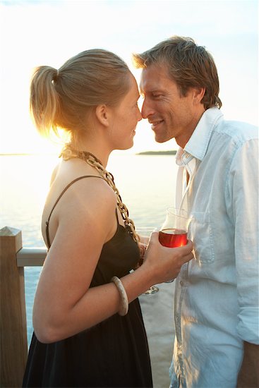 couple kissing sunset. Couple Kissing by the Lake at