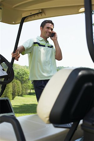 Golfer Using Cellphone Stock Photo - Premium Royalty-Free, Code: 600-01581830