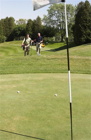 simsearch:600-01073545,k - People Playing Golf Stock Photo - Premium Royalty-Free, Code: 600-01581860