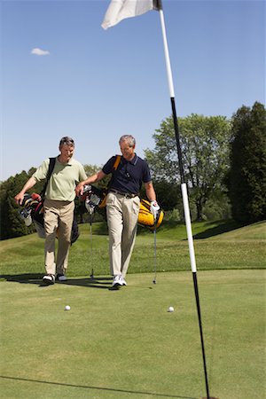 simsearch:600-02935461,k - People Playing Golf Stock Photo - Premium Royalty-Free, Code: 600-01581861