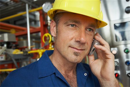 soul patch - Worker at Water Treatment Plant with Cellular Phone Stock Photo - Premium Royalty-Free, Code: 600-01582034