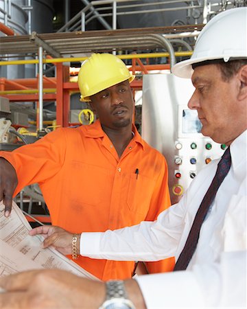 simsearch:700-00092284,k - Workers Looking at Document in Water Treatment Plant Stock Photo - Premium Royalty-Free, Code: 600-01582050