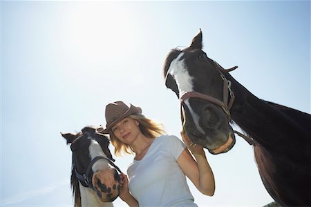 Woman with Horses Stock Photo - Premium Royalty-Free, Code: 600-01582238