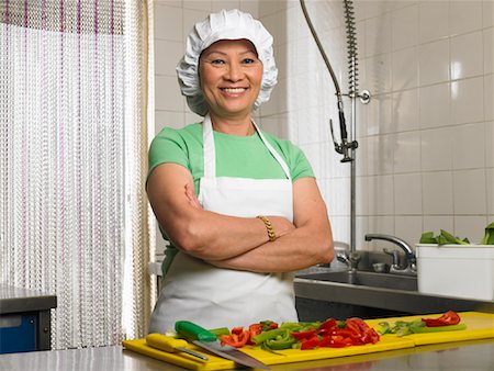 simsearch:600-03556558,k - Woman with Chopped Peppers in Restaurant Kitchen Stock Photo - Premium Royalty-Free, Code: 600-01593549