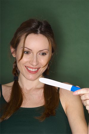 simsearch:600-01296088,k - Portrait of Woman with Pregnancy Test Stock Photo - Premium Royalty-Free, Code: 600-01605953