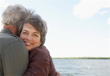 Couple Hugging by Water Stock Photo - Premium Royalty-Free, Code: 600-01606148