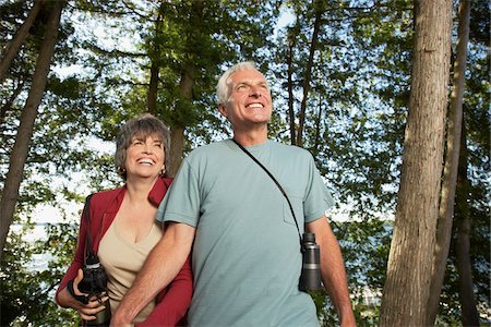sports and hiking - Couple Walking in Woods Stock Photo - Premium Royalty-Free, Code: 600-01606169