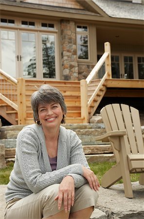 portrait smile caucasian one - Woman in Front of Home Stock Photo - Premium Royalty-Free, Code: 600-01606197