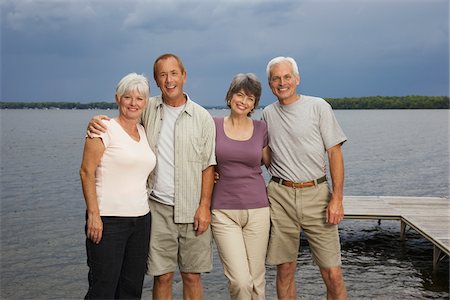 smile old lady - Couples on Dock by Lake Stock Photo - Premium Royalty-Free, Code: 600-01606204