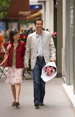 simsearch:600-00910373,k - Couple Walking on Sidewalk Stock Photo - Premium Royalty-Free, Code: 600-01606528