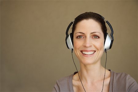 Woman Wearing Headphones Stock Photo - Premium Royalty-Free, Code: 600-01606605