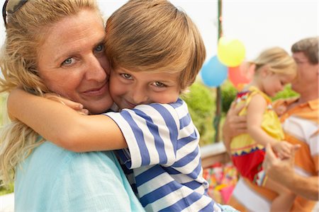 simsearch:700-03719333,k - Mother and Son Hugging Stock Photo - Premium Royalty-Free, Code: 600-01614166