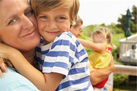 simsearch:700-03719333,k - Mother and Son Hugging Stock Photo - Premium Royalty-Free, Code: 600-01614167