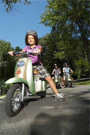 simsearch:600-01614282,k - Girl Riding Scooter Stock Photo - Premium Royalty-Free, Code: 600-01614240