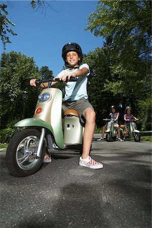 simsearch:600-01614282,k - Girl Riding Scooter Stock Photo - Premium Royalty-Free, Code: 600-01614241