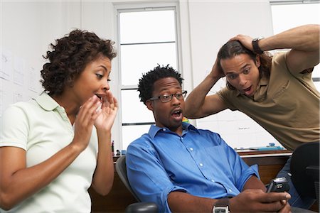 surprised black people - Coworkers working with each other Stock Photo - Premium Royalty-Free, Code: 600-01614903