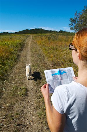 finding - Hiker Looking at Map Stock Photo - Premium Royalty-Free, Code: 600-01616573