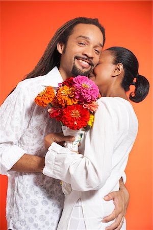 dreadlocks on african americans - Portrait of Couple With Flowers Stock Photo - Premium Royalty-Free, Code: 600-01613498