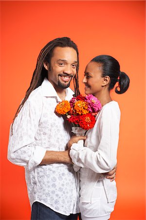dreadlocks on african americans - Portrait of Couple With Flowers Stock Photo - Premium Royalty-Free, Code: 600-01613499