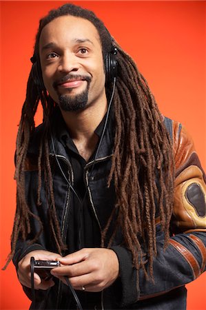 dreadlocks on african americans - Portrait of Man With MP3 Player Stock Photo - Premium Royalty-Free, Code: 600-01613491