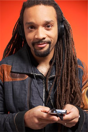 dreadlocks on african americans - Portrait of Man With MP3 Player Stock Photo - Premium Royalty-Free, Code: 600-01613492