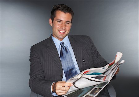 executive in the chair - Businessman Reading Newspaper Stock Photo - Premium Royalty-Free, Code: 600-01613615