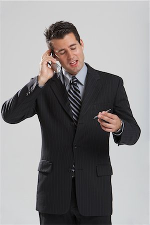 person on phone with credit card - Man with Credit Card and Cellular Phone Stock Photo - Premium Royalty-Free, Code: 600-01613633