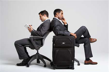 suitcase old - Businessmen Sitting Back to Back in Office Chairs Stock Photo - Premium Royalty-Free, Code: 600-01613721