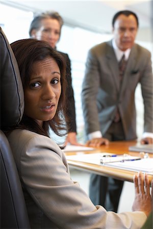 simsearch:600-01464382,k - Businesswoman in Meeting Looking Nervous Stock Photo - Premium Royalty-Free, Code: 600-01613741