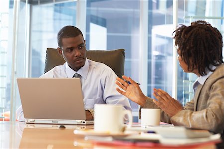 pictures of black people in boardroom meeting - Man in meeting Stock Photo - Premium Royalty-Free, Code: 600-01613790