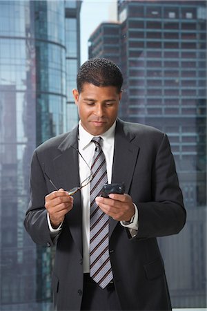 suit city good looking - Businessman with Cellular Phone Stock Photo - Premium Royalty-Free, Code: 600-01613937