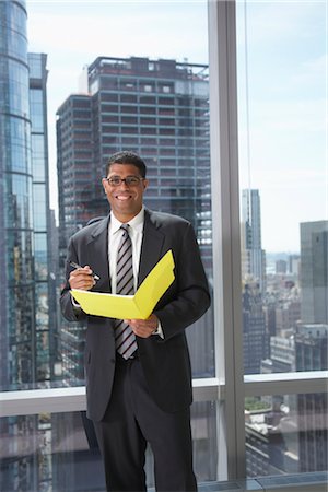 simsearch:600-01613965,k - Businessman with File Folder Stock Photo - Premium Royalty-Free, Code: 600-01613941