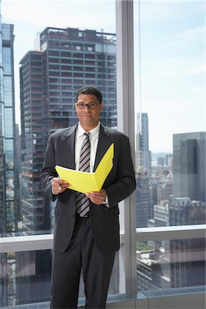 simsearch:600-01613965,k - Businessman with File Folder Stock Photo - Premium Royalty-Free, Code: 600-01613942