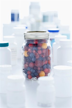 Jar Of Berries and Pill Bottles Stock Photo - Premium Royalty-Free, Code: 600-01630160