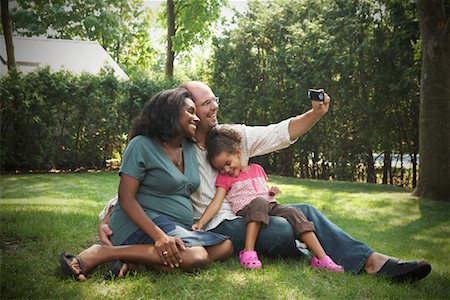 Man Taking Picture of Self and Family Stock Photo - Premium Royalty-Free, Code: 600-01644689