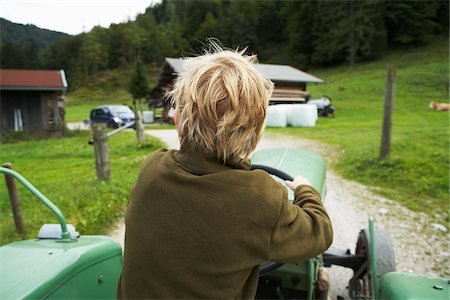 simsearch:700-06059677,k - Boy Riding Tractor Stock Photo - Premium Royalty-Free, Code: 600-01645037