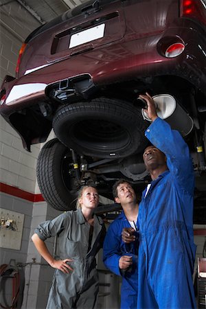 dirty look - Mechanics Working on Car Stock Photo - Premium Royalty-Free, Code: 600-01645964