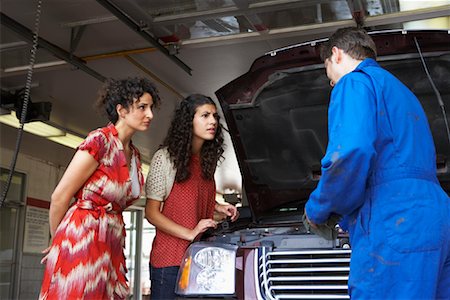 Women and Mechanic in Service Station Stock Photo - Premium Royalty-Free, Code: 600-01645960