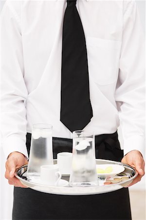 simsearch:600-01954641,k - Waiter Holding Tray of Drinks Stock Photo - Premium Royalty-Free, Code: 600-01646508