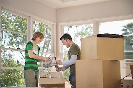 Couple Moving Into New Home Stock Photo - Premium Royalty-Free, Code: 600-01694080