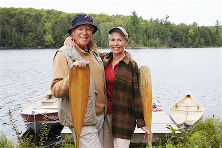 Couple by Dock with Canoe Paddles Stock Photo - Premium Royalty-Free, Code: 600-01694166